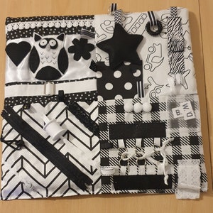 Baby sensory playmat. Montessori inspired black and white.  Also suitable for autism or dementia.