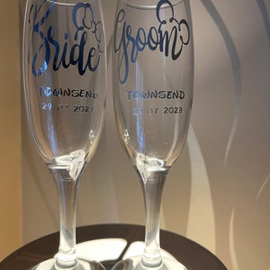 Disney themed wedding glasses Bride and Groom champagne glasses / personalised