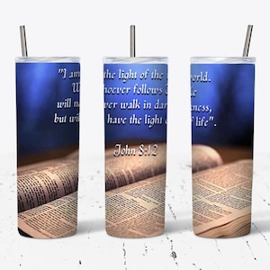 May include: A stainless steel tumbler with a blue background and a bible verse, "I am the light of the world. Whoever follows me will never walk in darkness, but will have the light of life." John 8:12