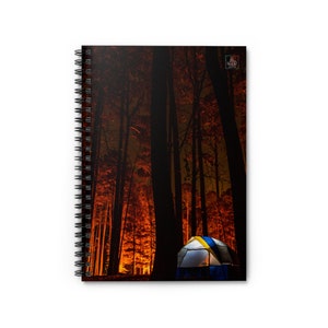 May include: A blue and yellow tent is set up in a forest at night. The trees are silhouetted against a bright orange glow, creating a dramatic scene.