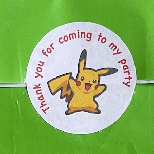 May include: A white round sticker with the text "Thank you for coming to my party" in red. A yellow cartoon character with a red smile is in the centre of the sticker.