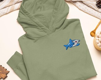 May include: An olive green hooded sweatshirt featuring an embroidered graphic of a small blue hammerhead shark on the left chest. The hoodie has long sleeves with ribbed cuffs, a front kangaroo pocket, and a matching olive green hood.