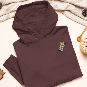 Sudadera con capucha de mezcla gruesa bordada con astronauta flotante: algodón suave y elegante, variedad de colores
