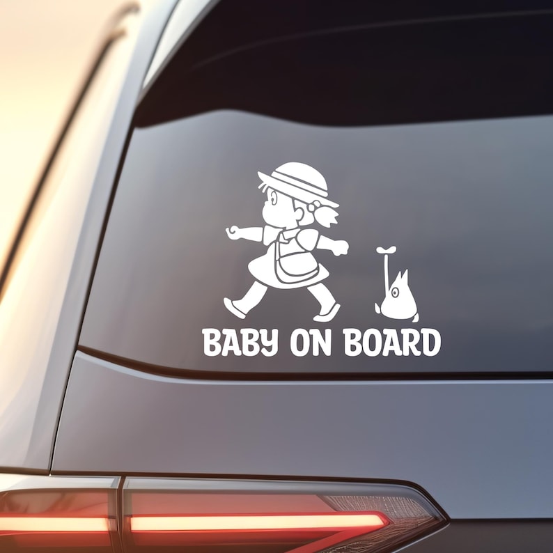 May include: White vinyl car sticker with a cartoon girl and a small flying creature. The text "BABY ON BOARD" is below the image.