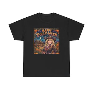 May include: A black t-shirt featuring a colorful graphic print of a smiling person wearing a cowboy hat, set against a background of a rustic cabin, autumn leaves, pumpkins, bats, and a crescent moon, with the text HAPPY DOLLY-WEEN at the top.