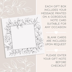 May include: A square white note card featuring a black line art botanical wreath frame. The text reads: EACH GIFT BOX INCLUDES YOUR MESSAGE PRINTED ON A GORGEOUS NOTE CARD SUITABLE FOR ANY OCCASION. BLANK CARDS ARE INCLUDED UPON REQUEST. PLEASE ENTER YOUR GIFT NOTE BEFORE CHECKOUT.