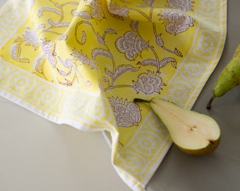 100% Cotton Napkins in a vibrant yellow and floral pattern.