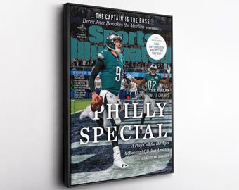 Könnte beinhalten: Gerahmtes Sports Illustrated-Cover mit dem Quarterback der Philadelphia Eagles. Das Cover trägt die Aufschrift "PHILLY SPECIAL" mit dem Text "THE CAPTAIN IS THE BOSS" und "Derek Jeter Remakes the Marlins". Das Bild zeigt einen Footballspieler in Aktion.