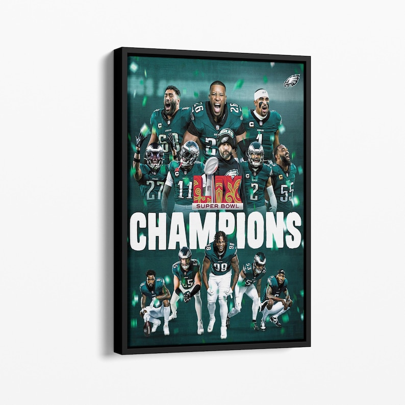 May include: A green and black framed print featuring a group of football players in green and white uniforms. The players are holding a trophy and the text "SUPER BOWL CHAMPIONS" is printed in white letters on a green background.