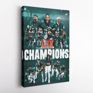 May include: A green and white Super Bowl Champions poster featuring a group of football players in green and white uniforms. The poster has the words "Super Bowl" and "Champions" in white text.