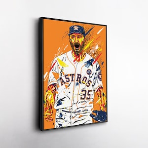 Può includere: Una stampa artistica incorniciata con un'illustrazione stilizzata di un giocatore di baseball in uniforme degli Houston Astros. L'opera d'arte utilizza colori vivaci, tra cui arancione, blu e bianco, con il numero 35 sulla maglia.