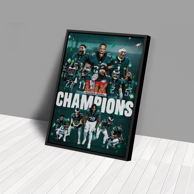 May include: A black framed poster with a green and white design featuring a group of football players celebrating. The players are wearing green and white uniforms and holding a trophy. The text "Champions" is printed in white letters on a green background. The text "Super Bowl" is printed in white letters on a red background.