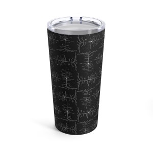 May include: A black stainless steel tumbler with a white pattern of neuron cells. The tumbler is a double-walled, vacuum-insulated design.
