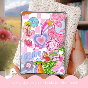 May include: A clear Kindle case insert with a collage of pink and blue retro-themed stickers. The design includes a cartoon character, a disco ball, a shooting star, and the text "AS IF!". The bottom of the insert reads "oh soy design | printable kindle insert".