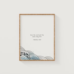 May include: A framed print with a blue and white illustration of waves and the text "Even the wind and the waves obey Him. -Matthew 8:27"