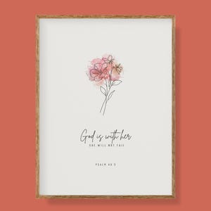 May include: A framed art print with a floral design in pink and peach watercolour. The artwork shows a line drawing of flowers and the text "God is with her, she will not fail" with Psalm 46:5 below. The frame is light brown.