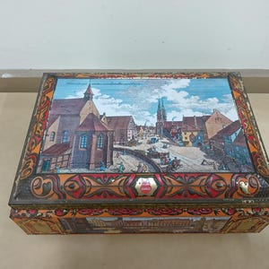 Collectable Highly decorative hinged metal Cookie Tin made in Germany by E. Otto Schmidt
