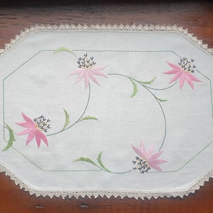Vintage hand embroidered table runner / doiley featuring pink lilies and crotcheted edge
