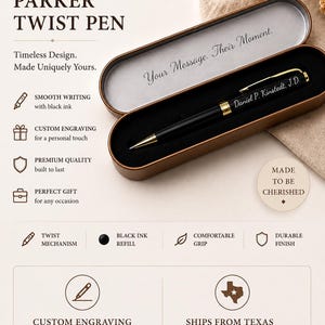 May include: A black twist pen with gold-tone accents and a gold clip, featuring the engraved name Daniel P. Kinstedt, J.D. The pen rests inside an open, elongated, metallic brown case with a black interior lining and a silver-colored lid interior.