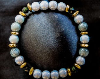 Pulsera de piedras preciosas inspirada en Arceus: ojo de águila, piedra dorada, hematita.