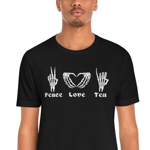 Peace Love Tea T-Shirt | Spill the Tea Halloween Shirt | Spill the Tea Skeleton Hands Gift | Cute Halloween Tea Lovers Gift | Spooky Tea Tee