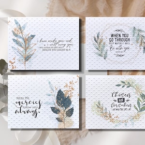 May include: Four white cards with inspirational quotes and floral designs. The quotes are: "I have made you and I will carry you. I will sustain you and I will rescue you Isaiah 46:4", "When you go through deep waters I will be with you Isaiah 43:2", "May His mercies follow you always", and "Chosen not forsaken I am who I say I am".