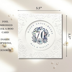 May include: A white card with a 5.5 inch by 5.5 inch design. The card features a white circle with the text "Happy Anniversary" and the number "70" in a colorful wreath. The text "Max & Vivian" is below the wreath. The card has a foil embossed peek-a-boo design.