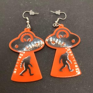 Abducting Bigfoot Earrings (Orange)