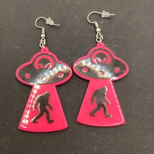 Abducting Bigfoot Earrings (Pink)