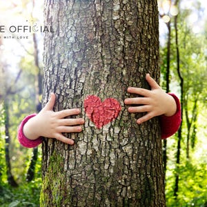 May include: A child's hands reach around a tree trunk, embracing it. A red heart is painted on the bark of the tree. The text "MARMALADE OFFICIAL HANDCRAFTED WITH LOVE" is at the top of the image.