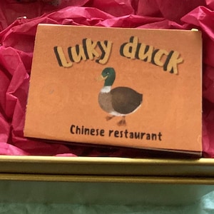 LUCKY DUCK 16 wünscht Streichholzschachtel