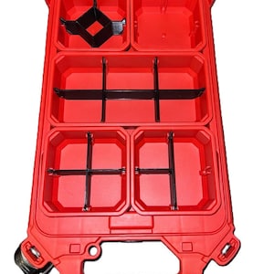May include: Open red plastic organiser with multiple compartments and black dividers. The organiser has a handle and is designed for storing small parts or tools. The lid is clear, allowing visibility of the contents.