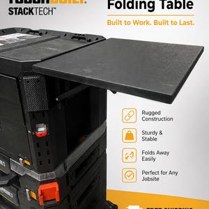May include: A black ToughBuilt StackTech folding table attached to a modular storage unit. The table features a flat, rectangular surface and a metal support arm. Text on the image includes ToughBuilt, StackTech, Folding Table, and Built to Work. Built to Last.