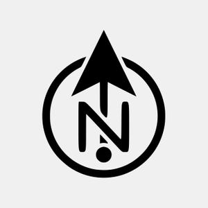 May include: A black and white compass rose design. The design features a black arrow pointing upwards, a stylized letter "N" below the arrow, and a black circle surrounding the arrow and letter. A small black dot is below the letter "N".
