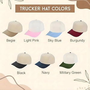 May include: A colour chart titled TRUCKER HAT COLORS displaying seven hats with white crowns and brims in beige, light pink, sky blue, burgundy, black, navy, and military green. Each hat is labelled with its corresponding colour name below it.