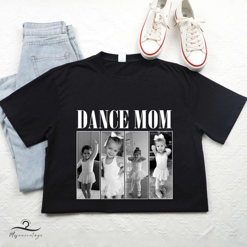 May include: Black t-shirt with the text "Dance Mom" in white letters. The shirt features a collage of three black and white photos of young girls in dance attire.