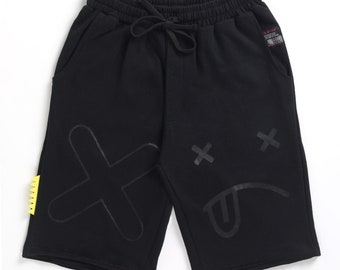 Face print black shorts