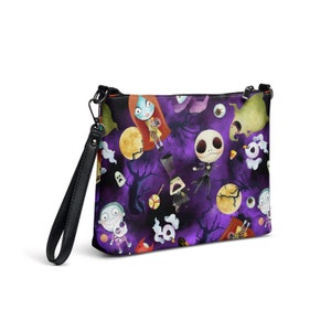 May include: A purple and black crossbody bag with a repeating pattern of characters from The Nightmare Before Christmas. The characters include Jack Skellington, Sally, and Zero. The bag has a black strap.
