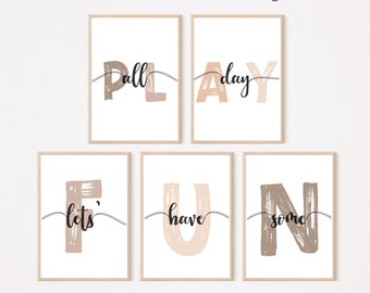 May include: Set of six printable wall art prints with the words "Let's have some fun all day" in a modern, minimalist style. The letters are in a brushstroke font and are in shades of brown and beige.