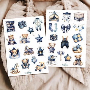 May include: Watercolor illustrations of baby-themed items in shades of blue and gold. The images include teddy bears, stars, a crib, a train, a stroller, and baby clothes. The illustrations are on white paper with the text "KarisDesign".