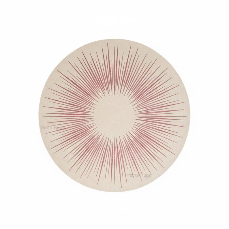 Top-down 8x8 round sunburst rug, cream center with pink and burgundy rays, flat wool weave