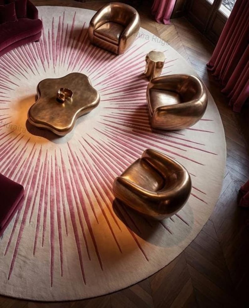 Living room vignette with 8x8 round sunburst rug, pink and beige tones radiating under brass tables