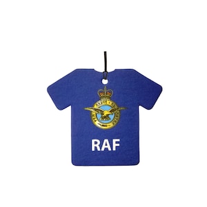 May include: A blue air freshener shaped like a t-shirt, featuring the RAF emblem and the letters "RAF" in white. The emblem includes a crown, eagle, and text. A black string is attached for hanging.