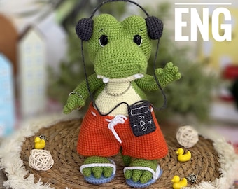 Amigurumi crochet PDF ENG pattern Crocodile in shorts with a music player
