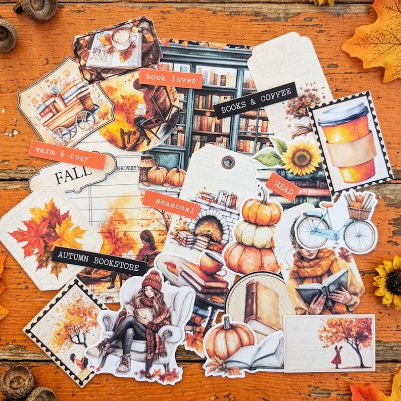 May include: A collection of autumn-themed paper ephemera featuring illustrations of pumpkins, books, coffee cups, and cozy scenes. Text labels include "book lover," "BOOKS & COFFEE," "WARM & COZY," "FALL," "seasonal," "READ," and "AUTUMN BOOKSTORE."