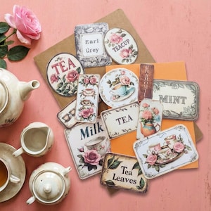May include: A collection of vintage-style tea-themed labels and tags with floral and teacup illustrations. The labels include text such as "Tea," "Earl Grey," "Milk," and "Mint." A teapot, teacup, and rose are also visible.