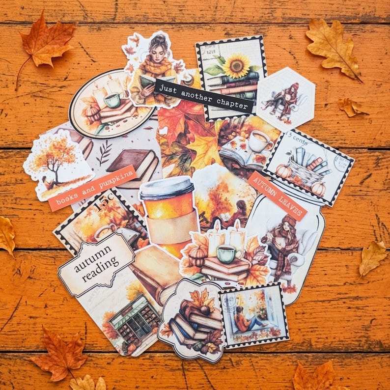 May include: A collection of autumn-themed stickers featuring illustrations of books, pumpkins, coffee cups, candles, and people reading. The stickers include text such as Just another chapter, books and pumpkins, autumn reading, and autumn leaves.