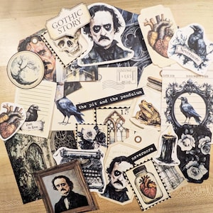 May include: A collection of gothic-themed paper ephemera, including illustrations of Edgar Allan Poe, ravens, hearts, and skulls. The pieces feature text like "Gothic Story," "Nevermore," and "The Pit and the Pendulum." The color palette is primarily black, white, and sepia.