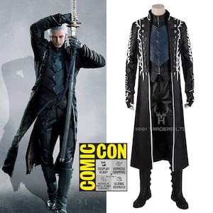 May include: Black cosplay costume featuring a long coat with white accents, a blue vest, and matching pants and boots. The image includes a character holding a sword and a separate display of the costume. The text "COMIC CON" is visible.
