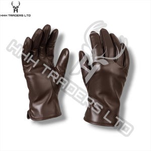 May include: A pair of dark brown leather gloves with visible stitching along the fingers and palms. The gloves feature a smooth finish and a simple cuff design. The text HHH TRADERS LTD is visible in the top left corner and as a watermark.